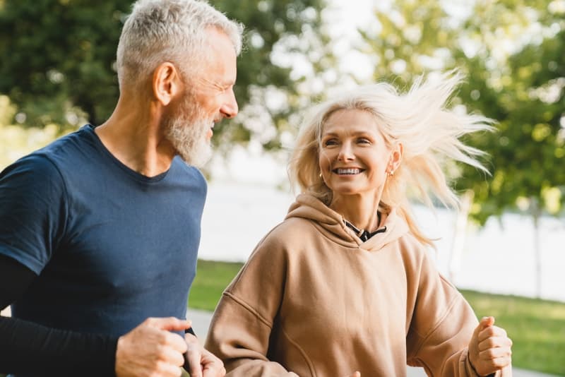 senior couple running